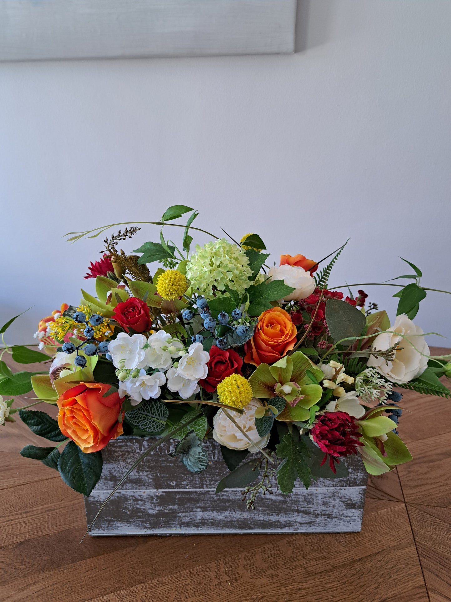Artificial Flower Arrangement in Wooden Box as an Office or Home Decoration