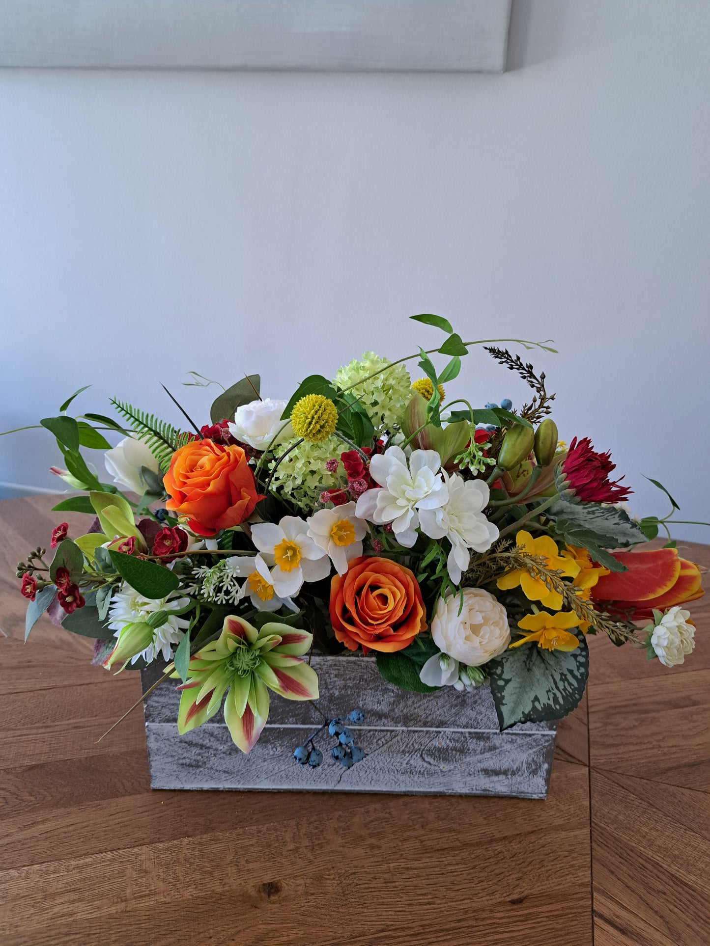 Artificial Flower Arrangement in Wooden Box as an Office or Home Decoration