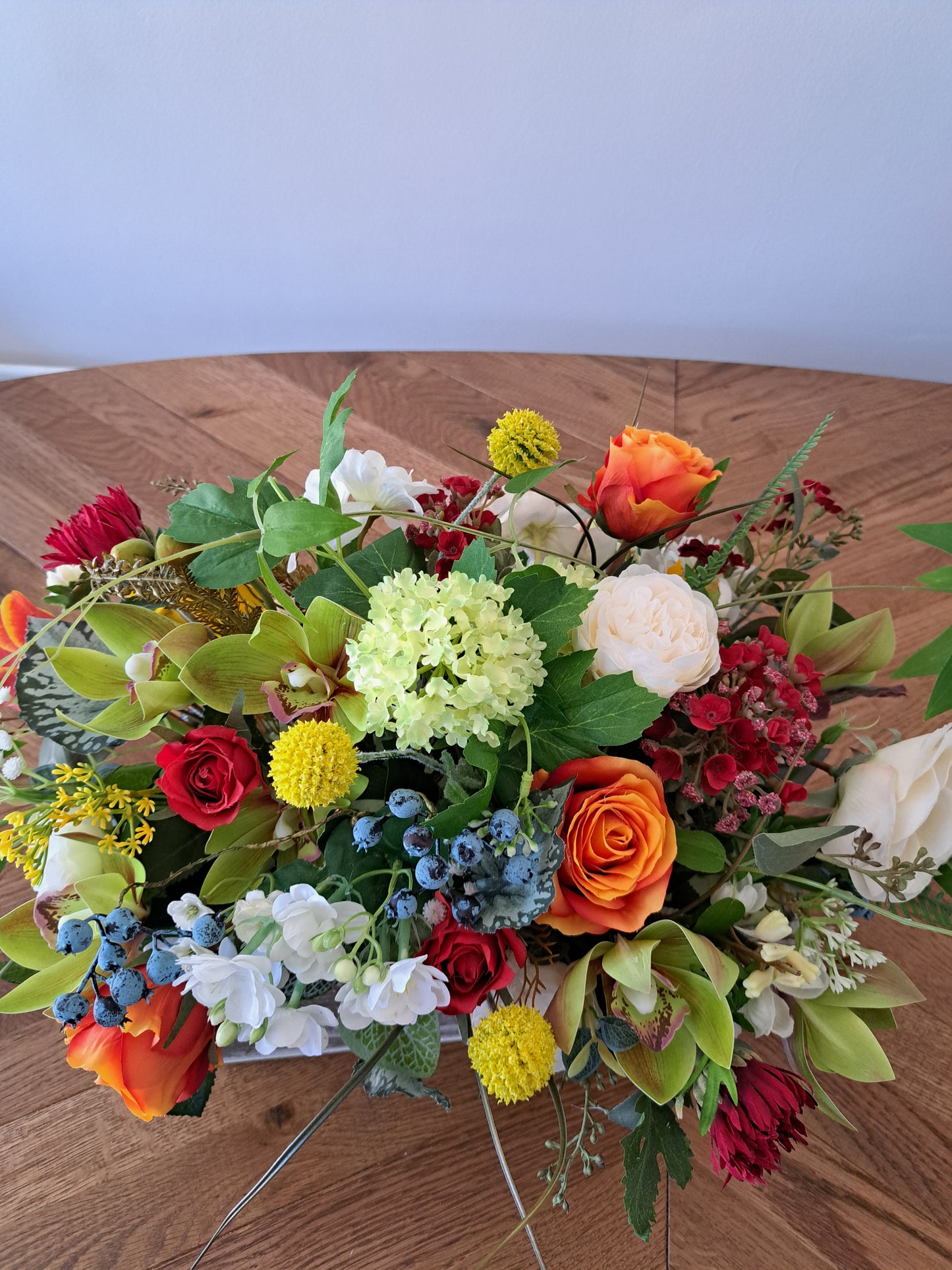 Artificial Flower Arrangement in Wooden Box as an Office or Home Decoration